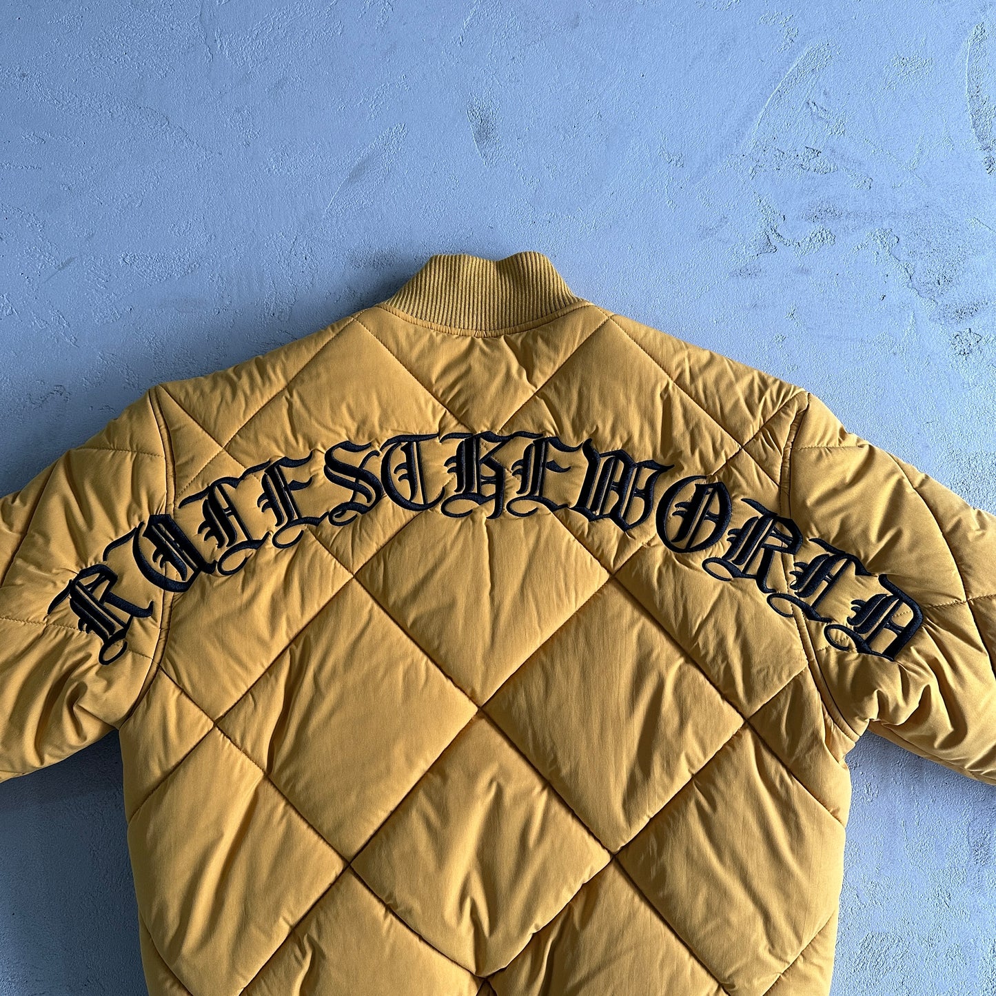 Corteiz Olde English Quilted Bomber Jacket Yellow