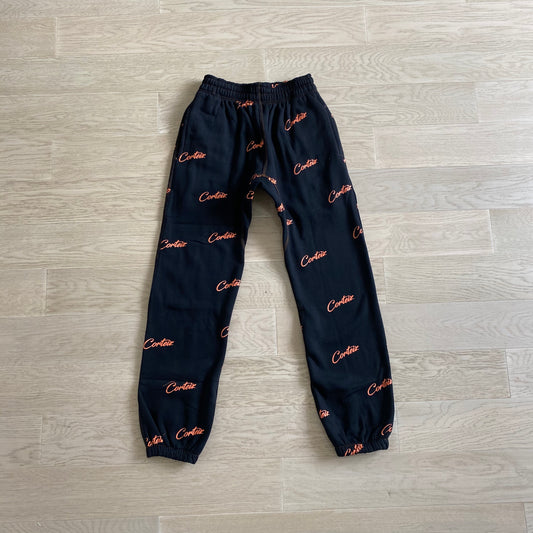 Corteiz All Over Print Joggers Black Orange