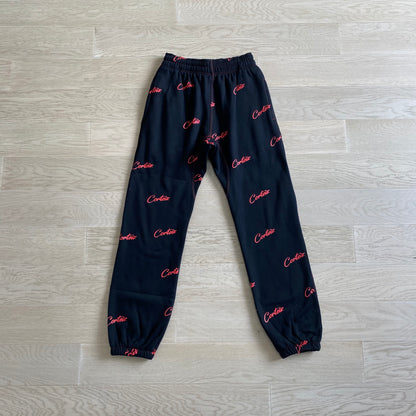 Corteiz All Over Print Joggers Black Red