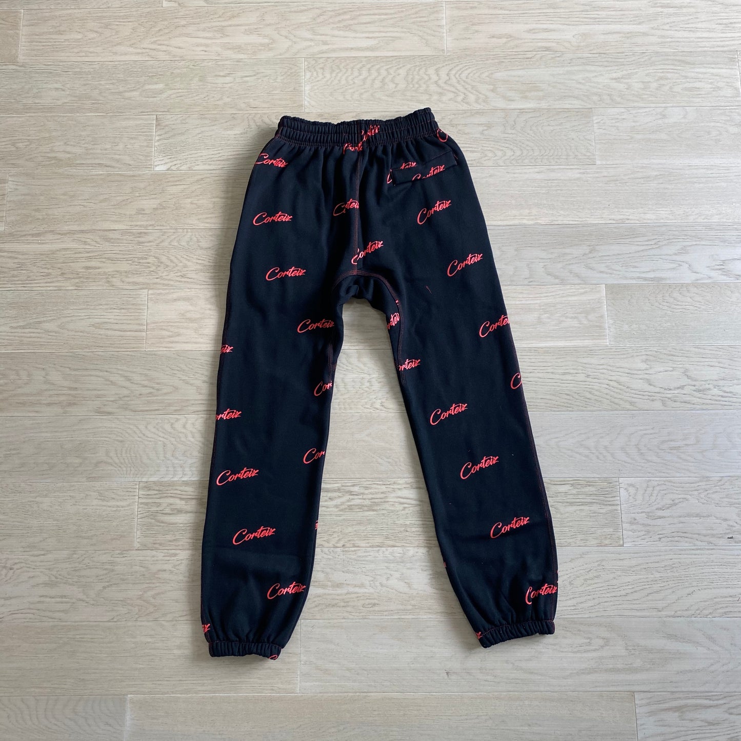 Corteiz All Over Print Joggers Black Red