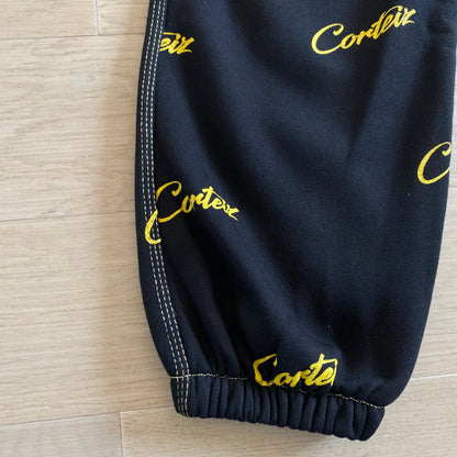 Corteiz All Over Print Joggers Black Yellow