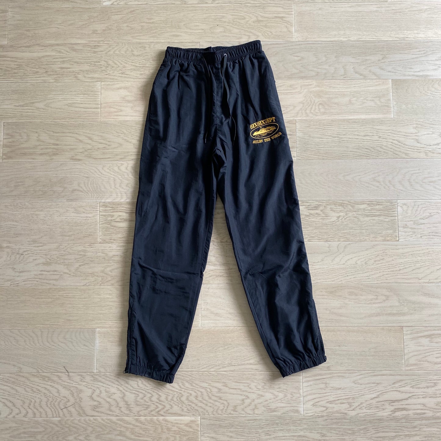 Corteiz x 667Ekip Shukushuku Track Pants Black Gold