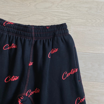 Corteiz All Over Print Joggers Black Red