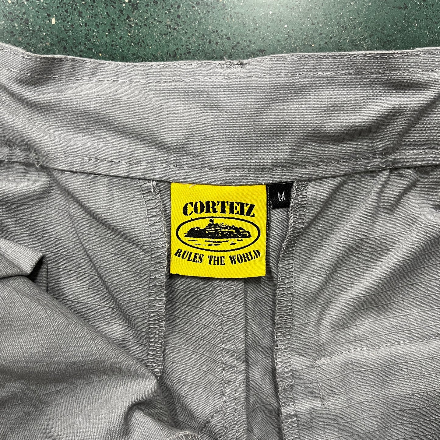 Corteiz Guerillaz Cargo Pants Stone Grey